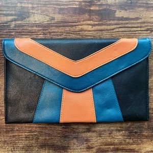 Blue black orange clutch with zipper. Bold fun colours. Statement piece. Trendy.